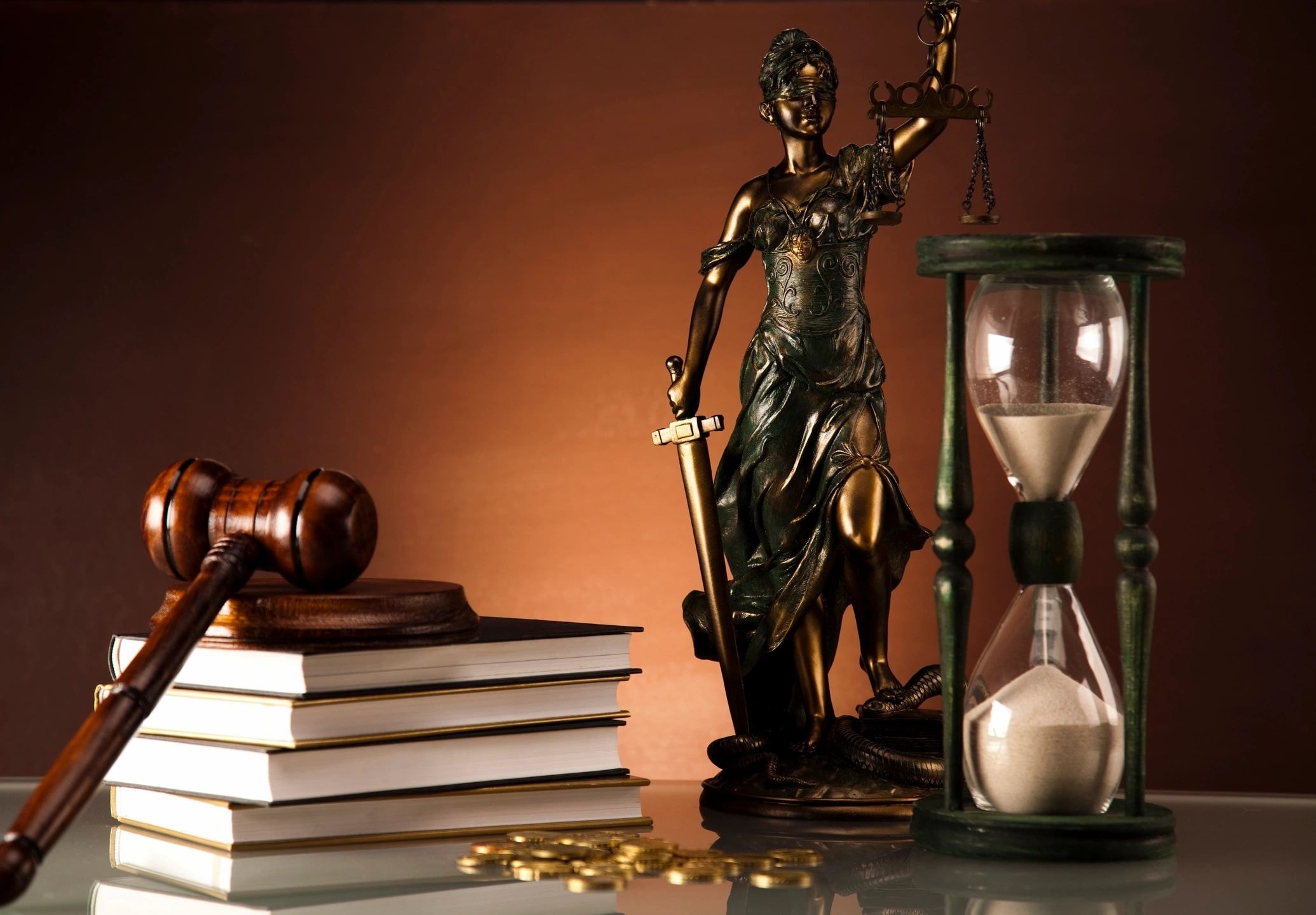 Legal scales, gavel, and Lady Justice representing the justice system