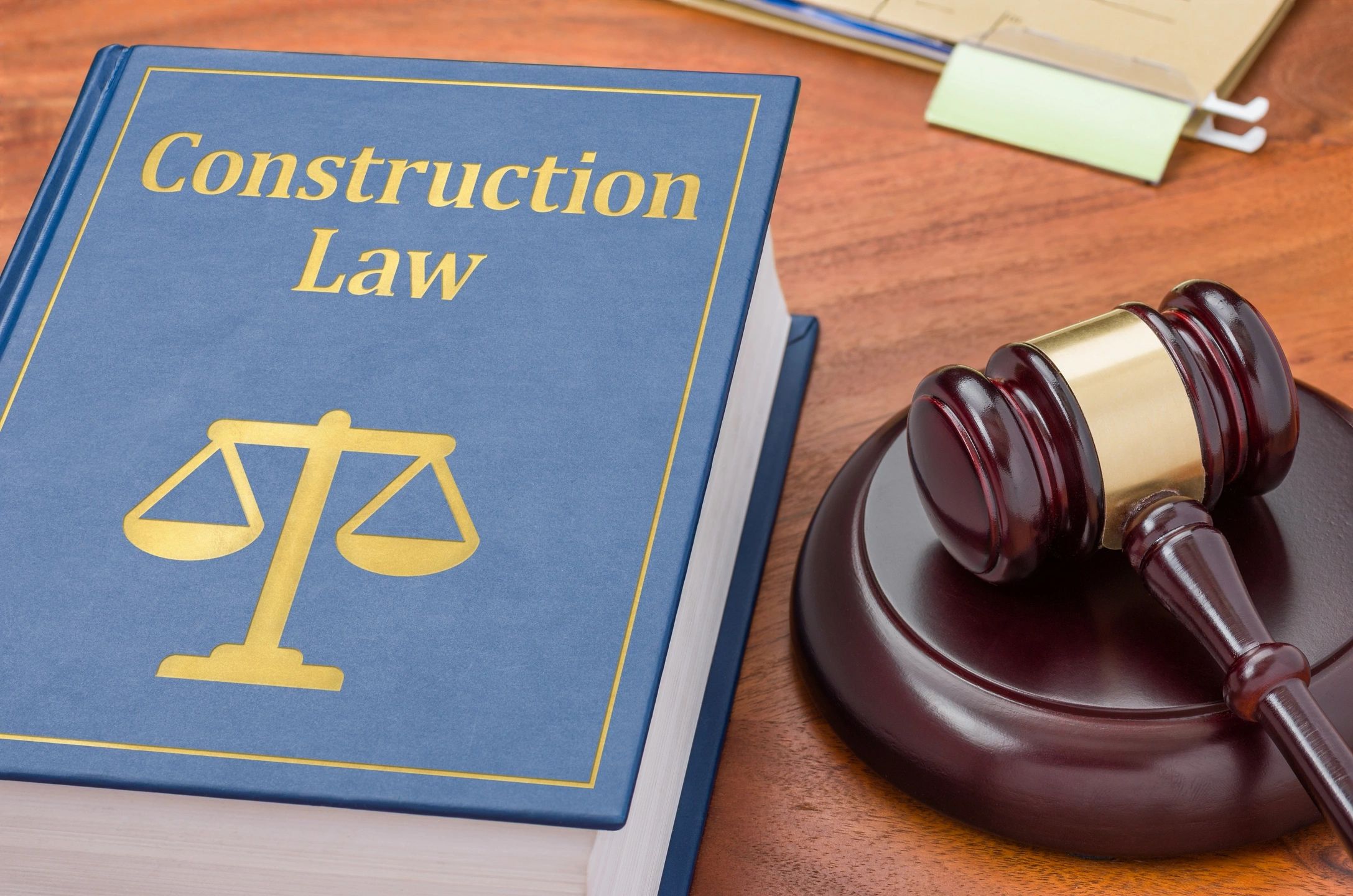 Construction law book and gavel on desk